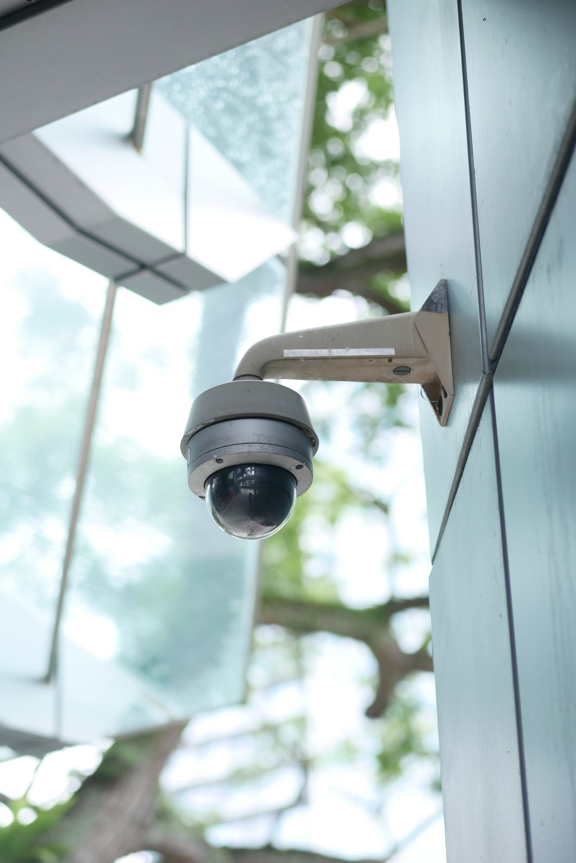 Dome security camera mounted on a modern building