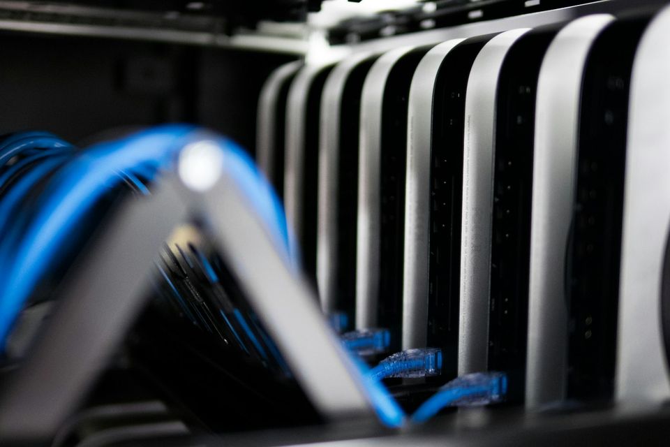 Network cables connected to servers in a rack